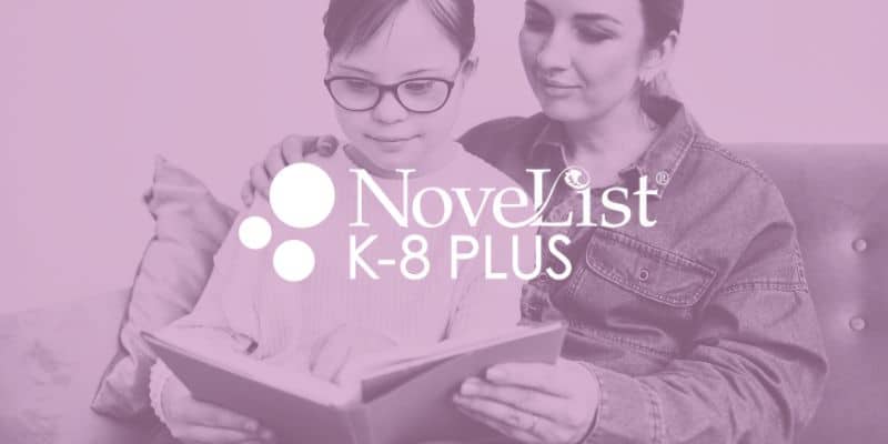 Child and adult reading together
