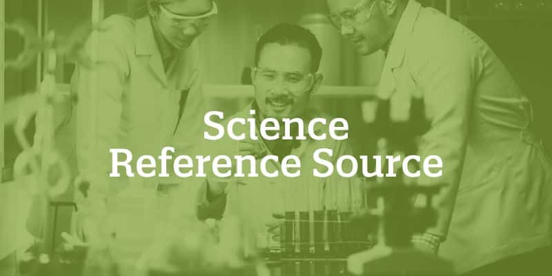 group of scientists examining test tubes