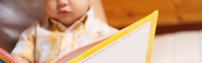 Baby reading a book