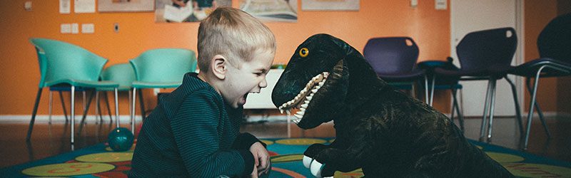 Little boy with dinosaur