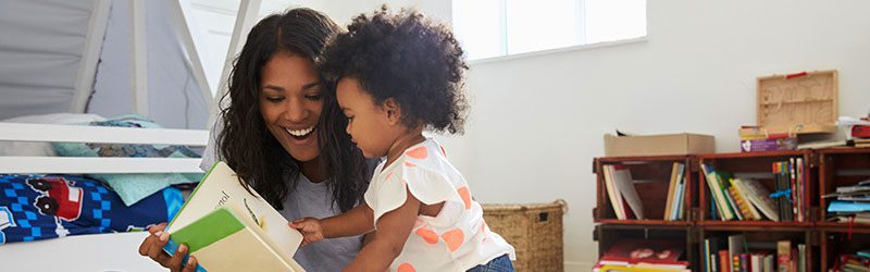 Mom and baby reading a book