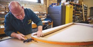 Conservation Center crafts a new frame for the library's Scoville Window