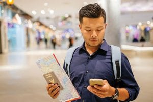 Man holding map and cellphone