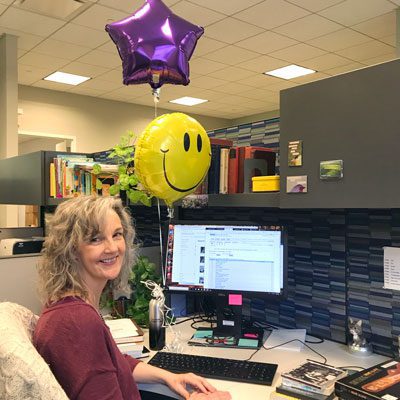 Debbie Rafine at her desk