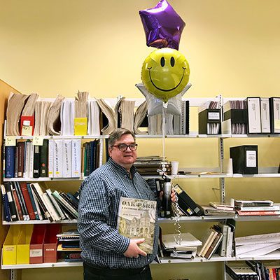 Ed O'Brien in front of library shelves