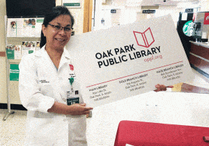 Rush Oak Park Hospital staff holds a novelty library card