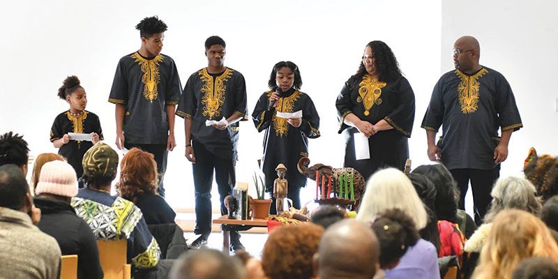 Community members celebrating Kwanzaa in the Main Library Veterans Room 2018