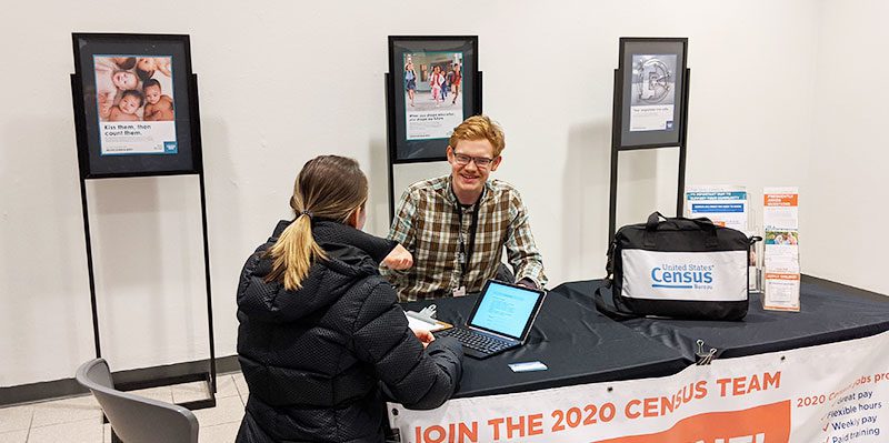 Eric Luepke talking with a patron at the library