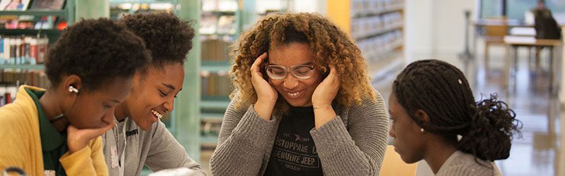 Teens studying at the library