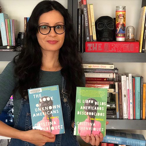 Nora with two copies of The Book of Unknown Americans