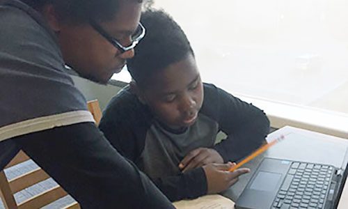 Tutor helping student
