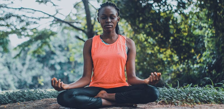 Woman meditating outside