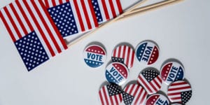 Pile of small American flags and I Voted buttons