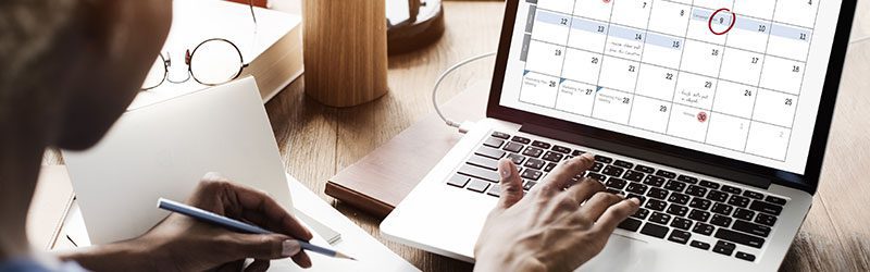 Patron on laptop with calendar view