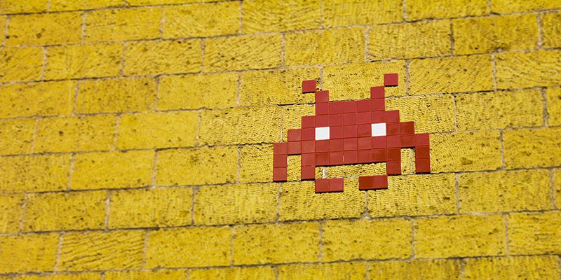 Pixel alien on wall