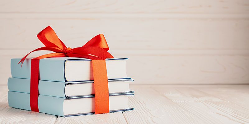 Stack of books with bow