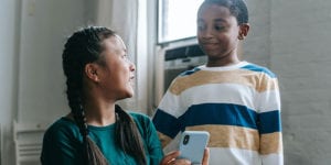 Two kids with cell phone