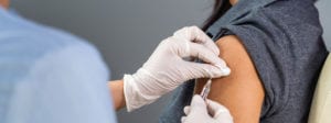 Person receiving a vaccine