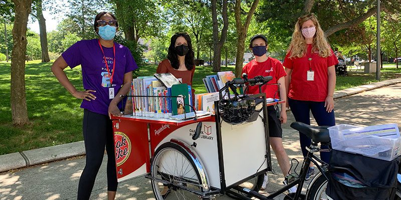 Community Engagement team with the Paperback Rider