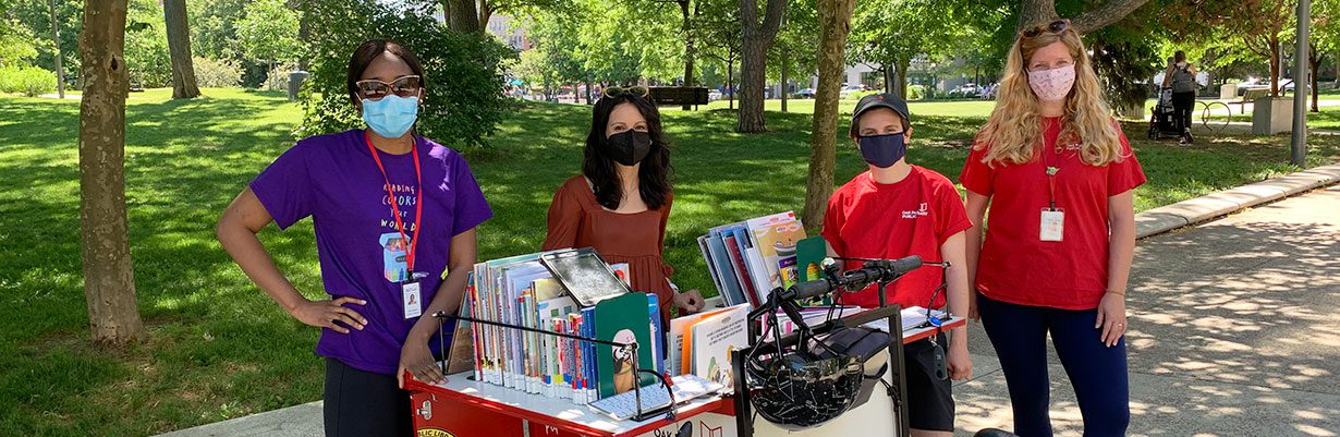 Community Engagement team with the Paperback Rider
