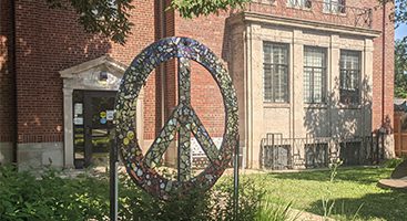 Dole Branch exterior and peace sign sculpture