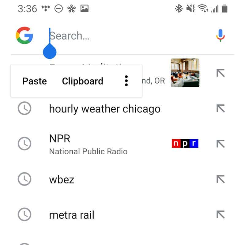 A screenshot of an Android phone screen with a cursor inside of a Google searchbox and a menu below that reads Paste and Clipboard