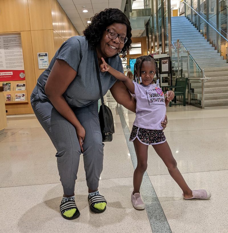 Adult and child with new library cards