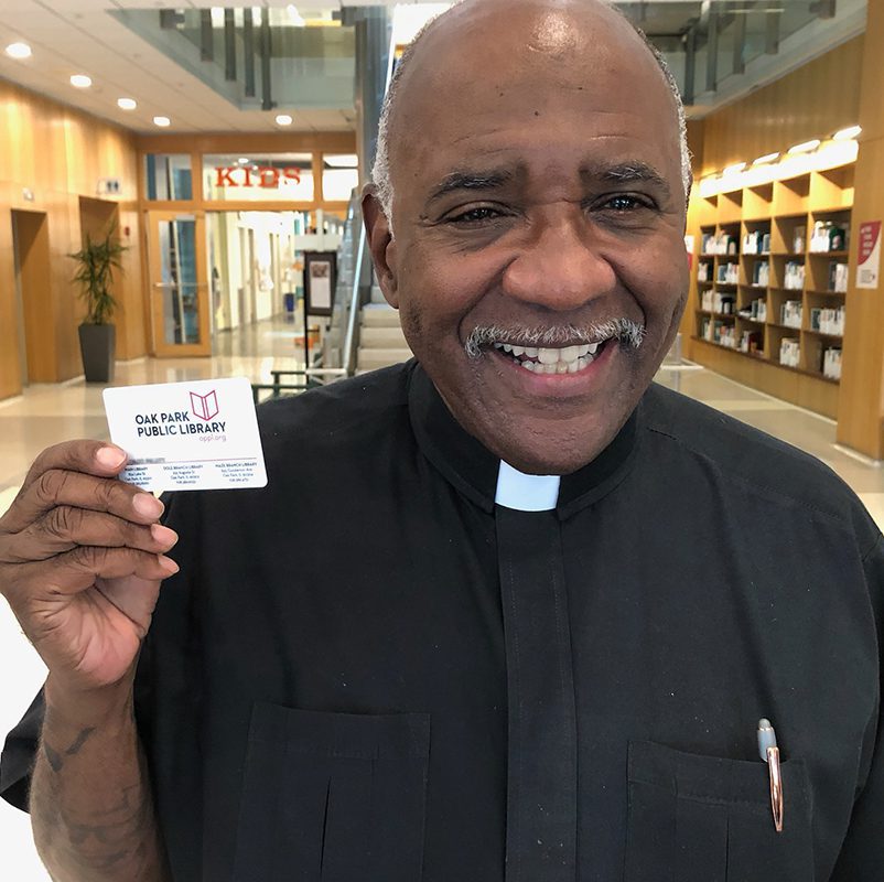 Man holding library card