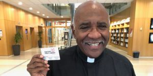 Patron posing with new library card