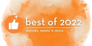 Best of 2022: Movies, music & more text next to a thumbs up icon with sparkles floating above, all on a misty orange orb background