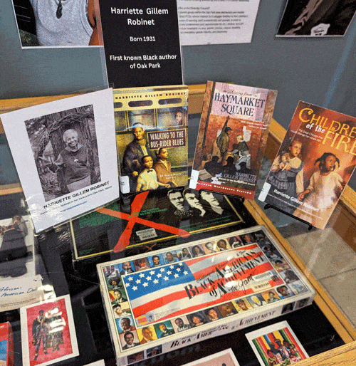 Display of books by Harriet Gillem Robinet and other artifacts in the Main Library Idea Box