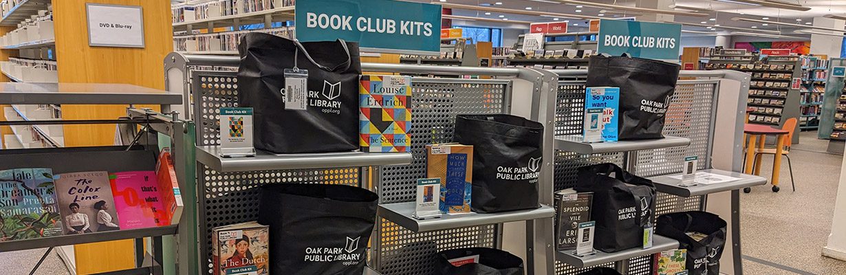 Book Club Kit books and tote bags on shelves