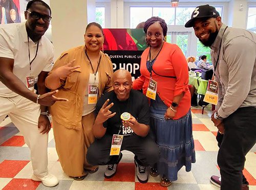 Library staff Stephen Jackson, Juanta Griffin, Latonia Jackson, and Chibuike Enyia pose with Ralph McDaniels (center) at the Hip Hop Summit