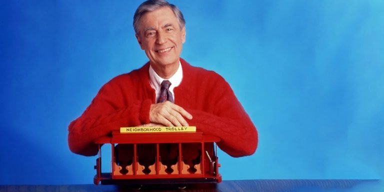 Still, promotional image for Mister Rogers with Fred Rogers posing with the Neighborhood Trolley
