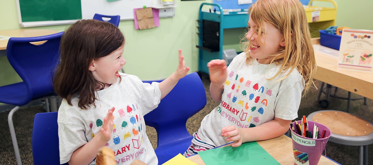 Smiling girls playing in the Acorn Studio