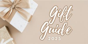 Gift Guide 2025 text alongside two gift boxes wrapped in white and gold paper with ribbons.