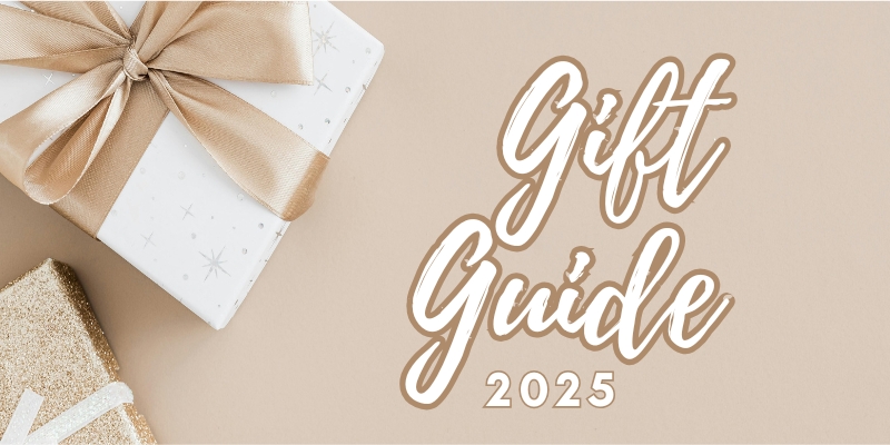 Gift Guide 2025 text alongside two gift boxes wrapped in white and gold paper with ribbons.
