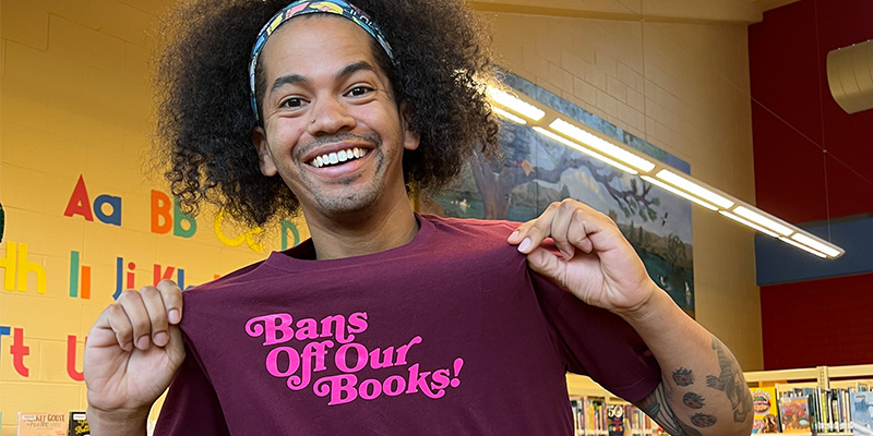 Mychal Threets shows T-shirt reading "Bans Off Our Books!"