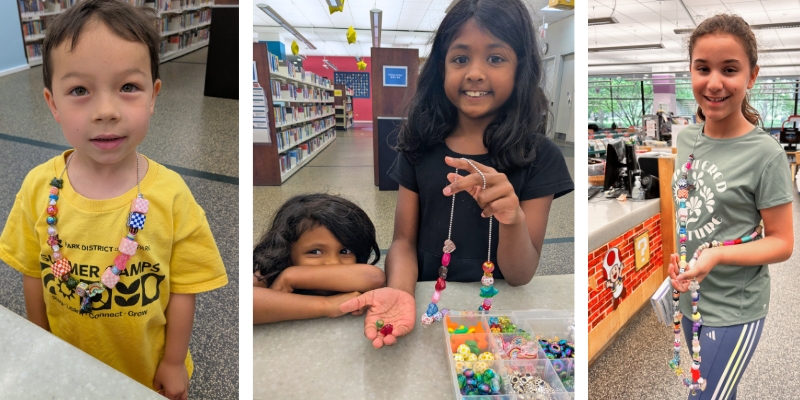 Kids show off their summer reading beads and necklaces.