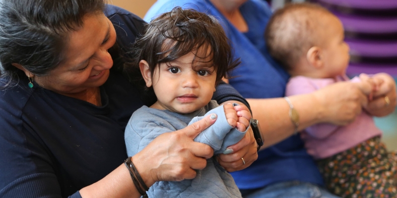 Babies and adults at library storytime.