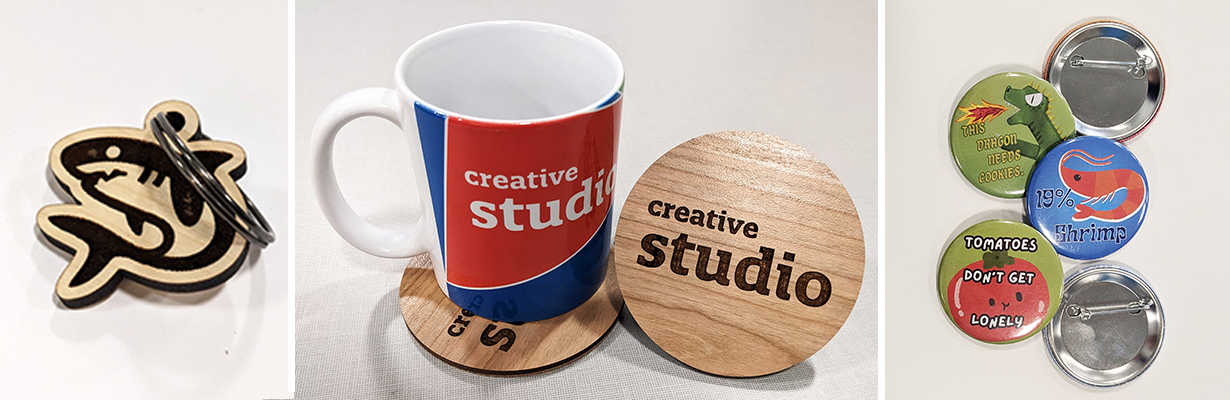 Collage of items made in the Creative Studio: A wooden shark keychain, a mug with a coaster, and an assortment of pinback buttons
