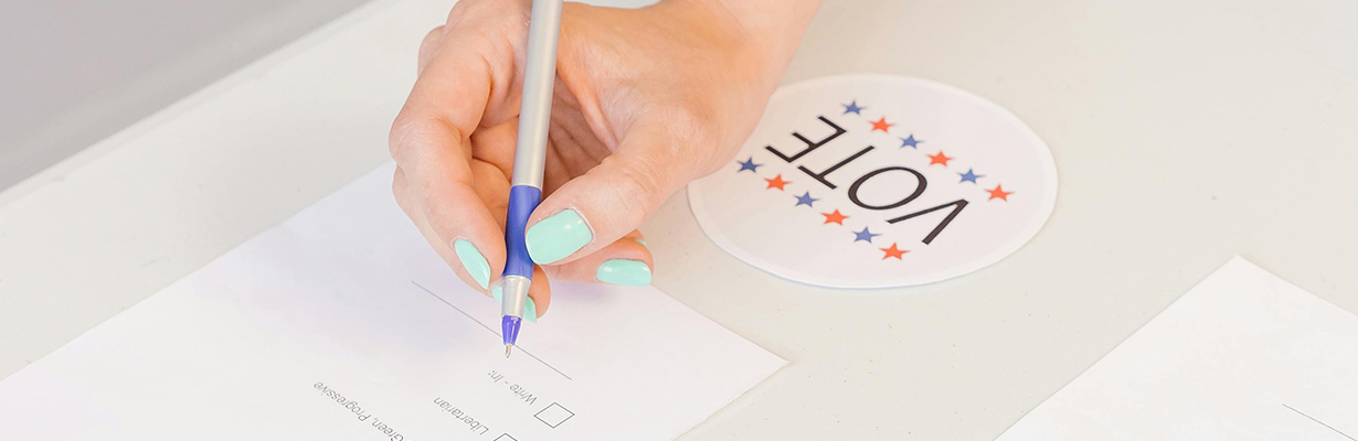 Person selecting votes on white paper