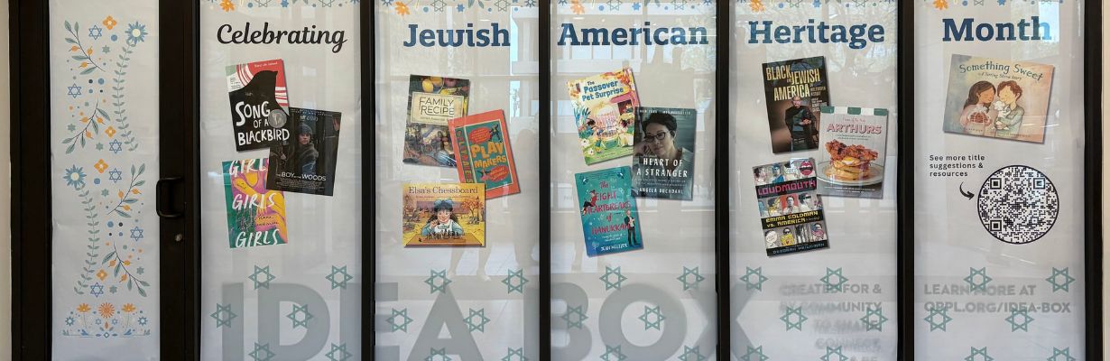 Poster display featuring book titles by Jewish American authors in celebration of Jewish American Heritage Month