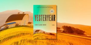 Book cover of "Yesteryear: a novel" in front of a background of the book cover, a barn with trees and grass.